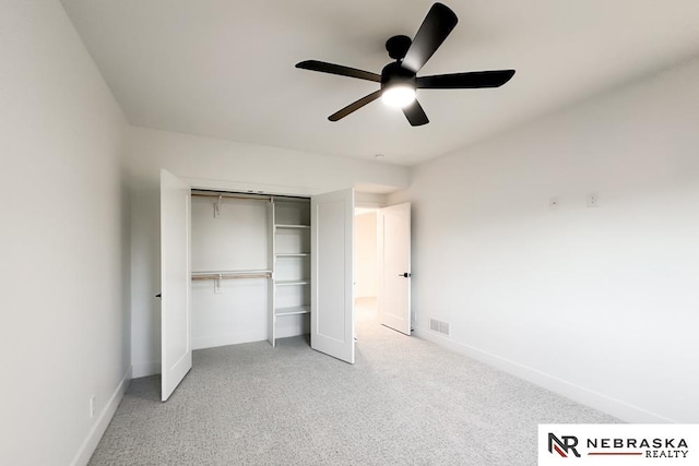 unfurnished bedroom with a closet, ceiling fan, and carpet flooring