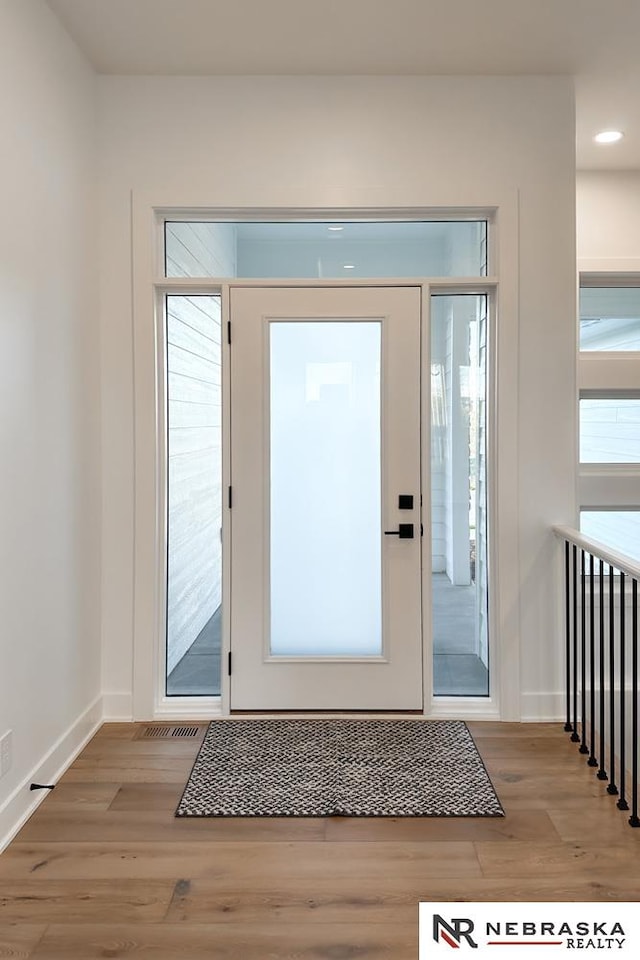 doorway to outside featuring light hardwood / wood-style floors