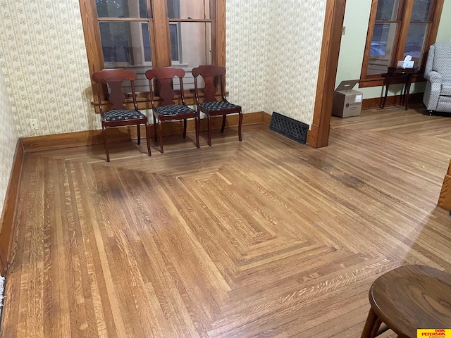 sitting room featuring parquet flooring