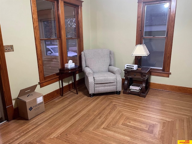 sitting room with light parquet flooring