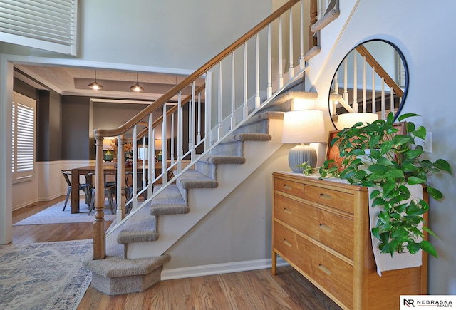 stairs featuring hardwood / wood-style flooring