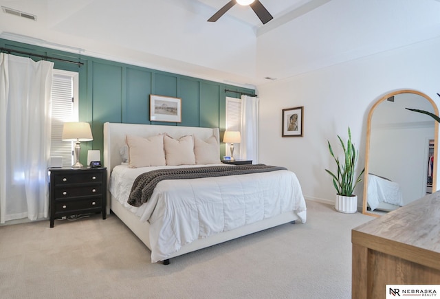 bedroom with light carpet and ceiling fan