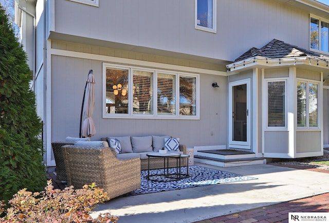 exterior space with an outdoor hangout area and a patio area