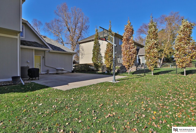 exterior space with basketball court and central AC unit