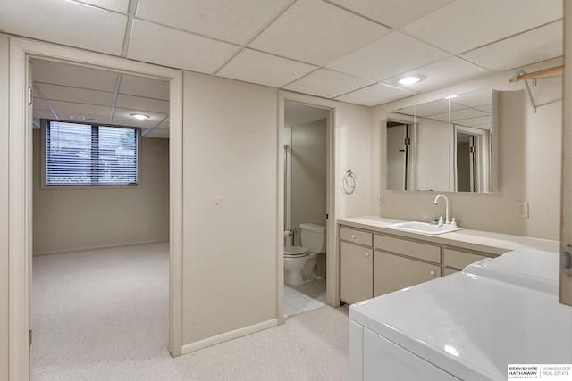 bathroom featuring vanity, a paneled ceiling, and toilet