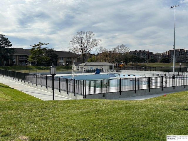 view of pool featuring a yard and a patio area