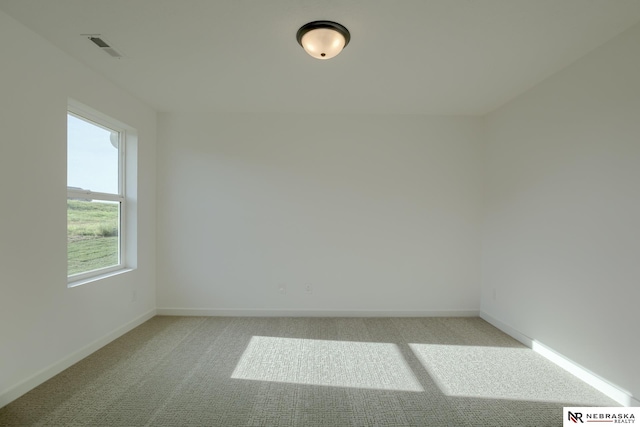 empty room with light colored carpet