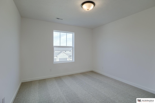 unfurnished room with carpet flooring