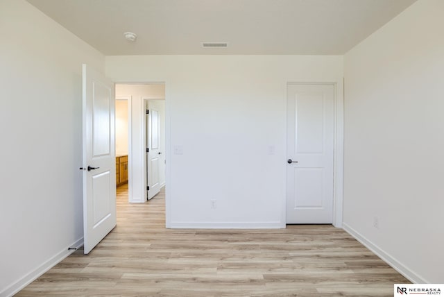 unfurnished bedroom with light hardwood / wood-style flooring