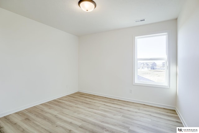 unfurnished room featuring light wood-type flooring