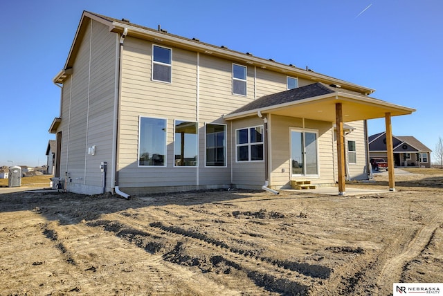 back of house with a patio area