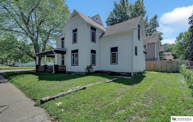 view of property exterior with a lawn