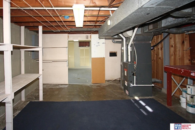 basement featuring heating unit