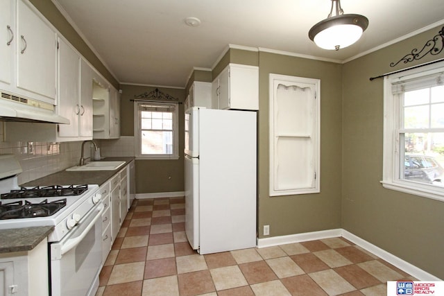 kitchen featuring sink, backsplash, crown molding, white appliances, and white cabinets