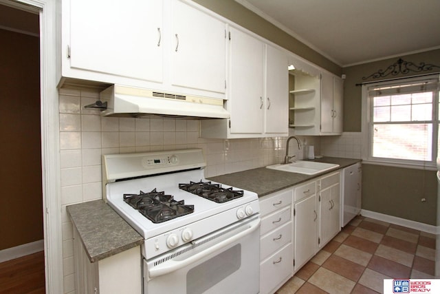 kitchen with white cabinets, decorative backsplash, white appliances, and ornamental molding