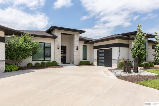 prairie-style house featuring a garage