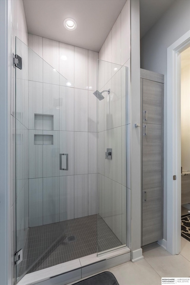 bathroom featuring tile patterned flooring and walk in shower