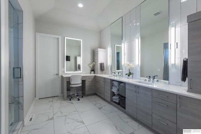 bathroom featuring vanity and an enclosed shower