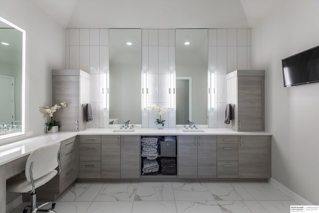 bathroom with vanity and vaulted ceiling