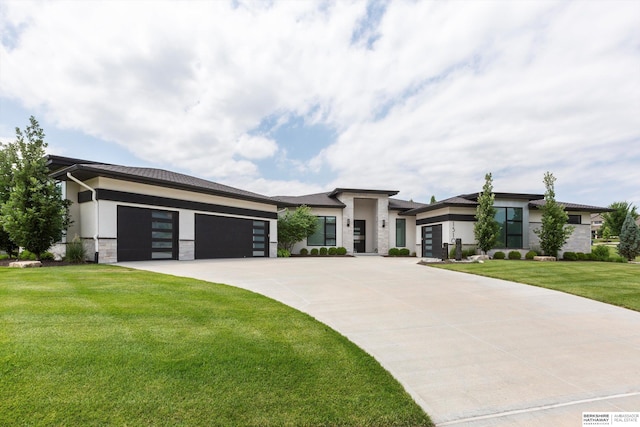 view of front facade with a front lawn and a garage