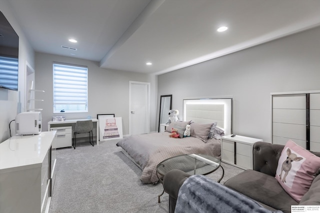 bedroom with light colored carpet