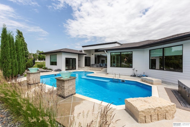 view of swimming pool featuring a patio