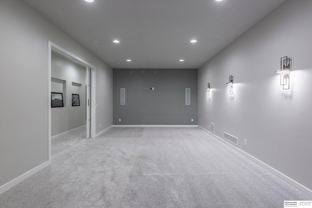 empty room featuring light colored carpet