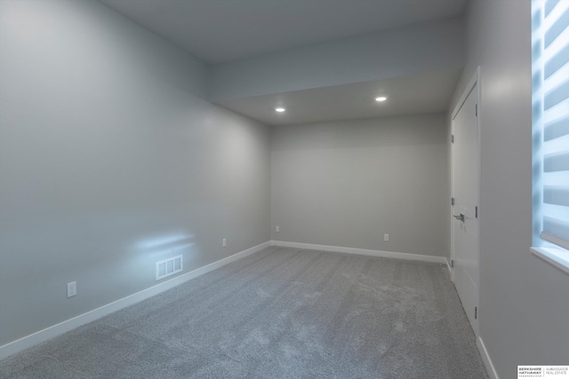 empty room with carpet flooring