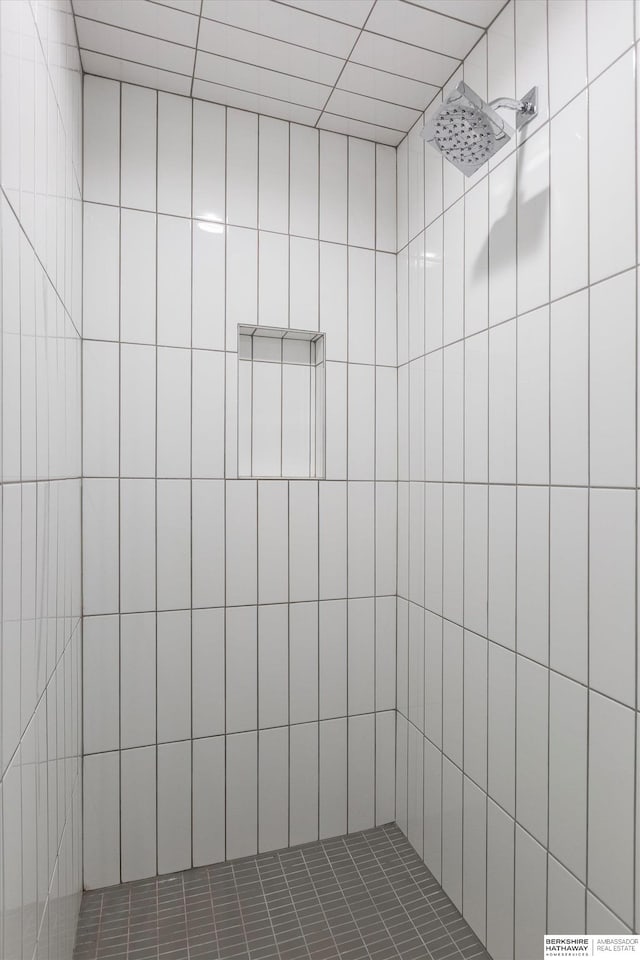 bathroom with tiled shower