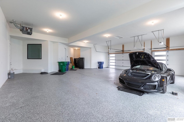 garage featuring a garage door opener