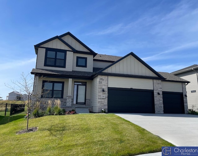 craftsman-style home with a front yard and a garage