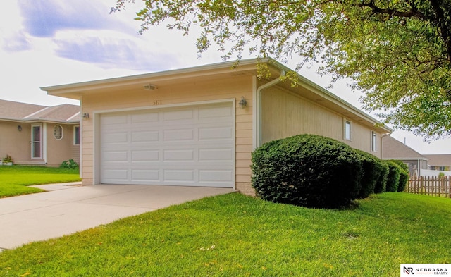 exterior space featuring a yard and a garage