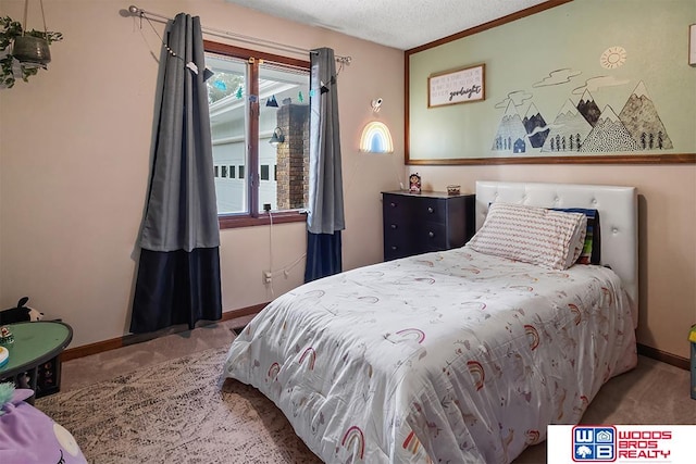 bedroom featuring carpet and a textured ceiling