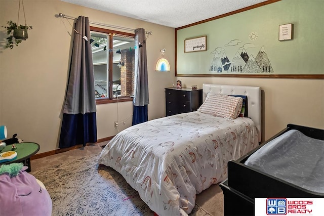 bedroom with a textured ceiling and crown molding