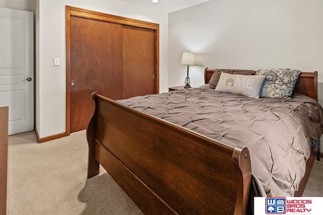 carpeted bedroom with a closet