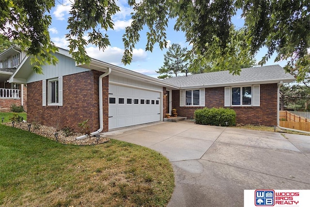 single story home with a garage and a front yard