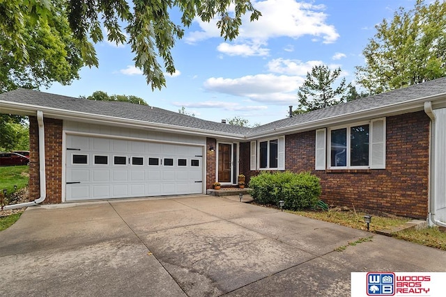 ranch-style house featuring a garage