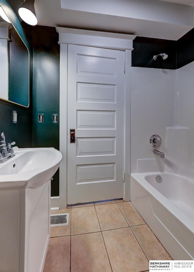 bathroom featuring tile patterned floors, vanity, and shower / bathtub combination