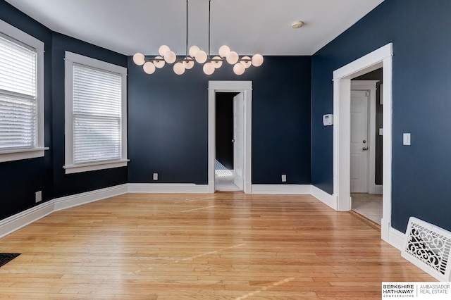 unfurnished dining area featuring light hardwood / wood-style flooring