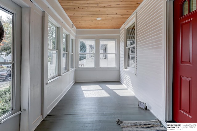 unfurnished sunroom with wooden ceiling