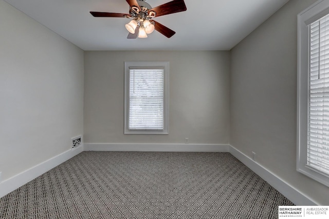 carpeted empty room featuring ceiling fan