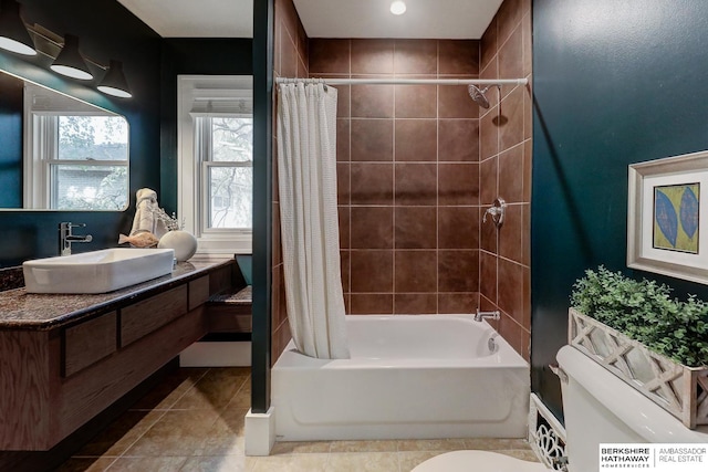 full bathroom with tile patterned flooring, vanity, toilet, and shower / bathtub combination with curtain