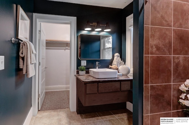 bathroom with tile patterned flooring and vanity