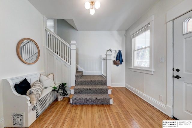 entrance foyer with a wealth of natural light and light wood-type flooring