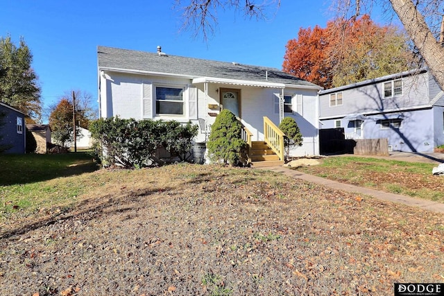 view of front of home with a front lawn