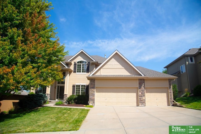 craftsman house featuring a front yard and a garage