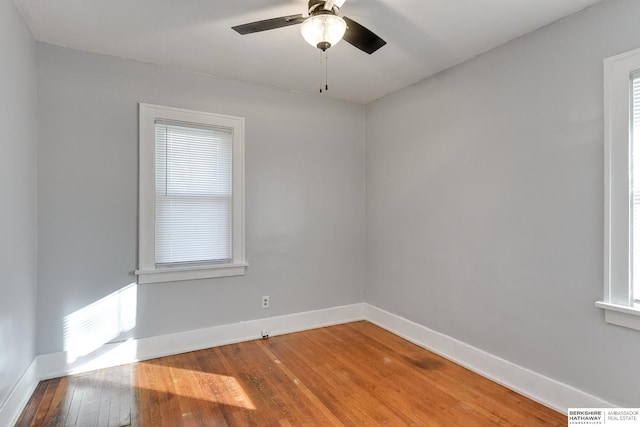 unfurnished room with ceiling fan and wood-type flooring