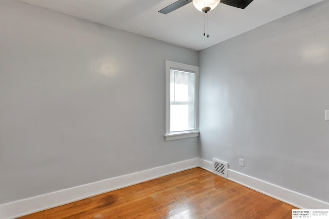 spare room featuring ceiling fan and light hardwood / wood-style flooring