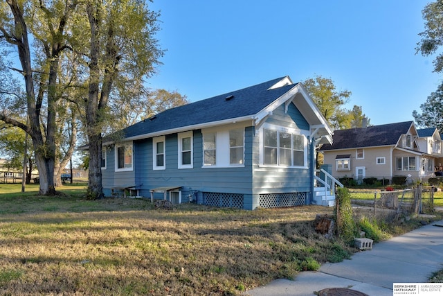 view of home's exterior with a yard