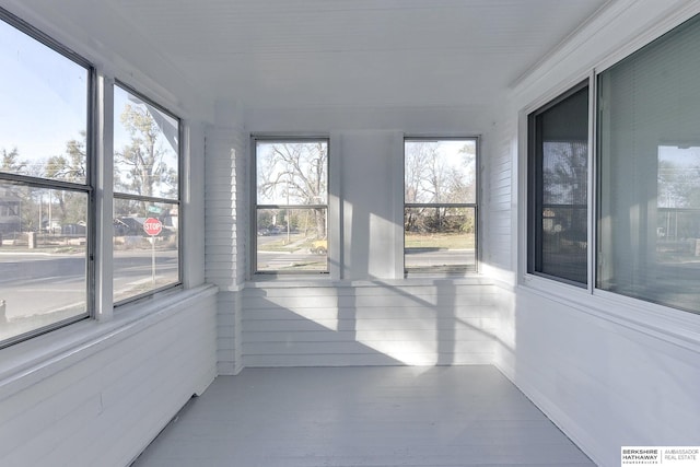 unfurnished sunroom featuring a healthy amount of sunlight